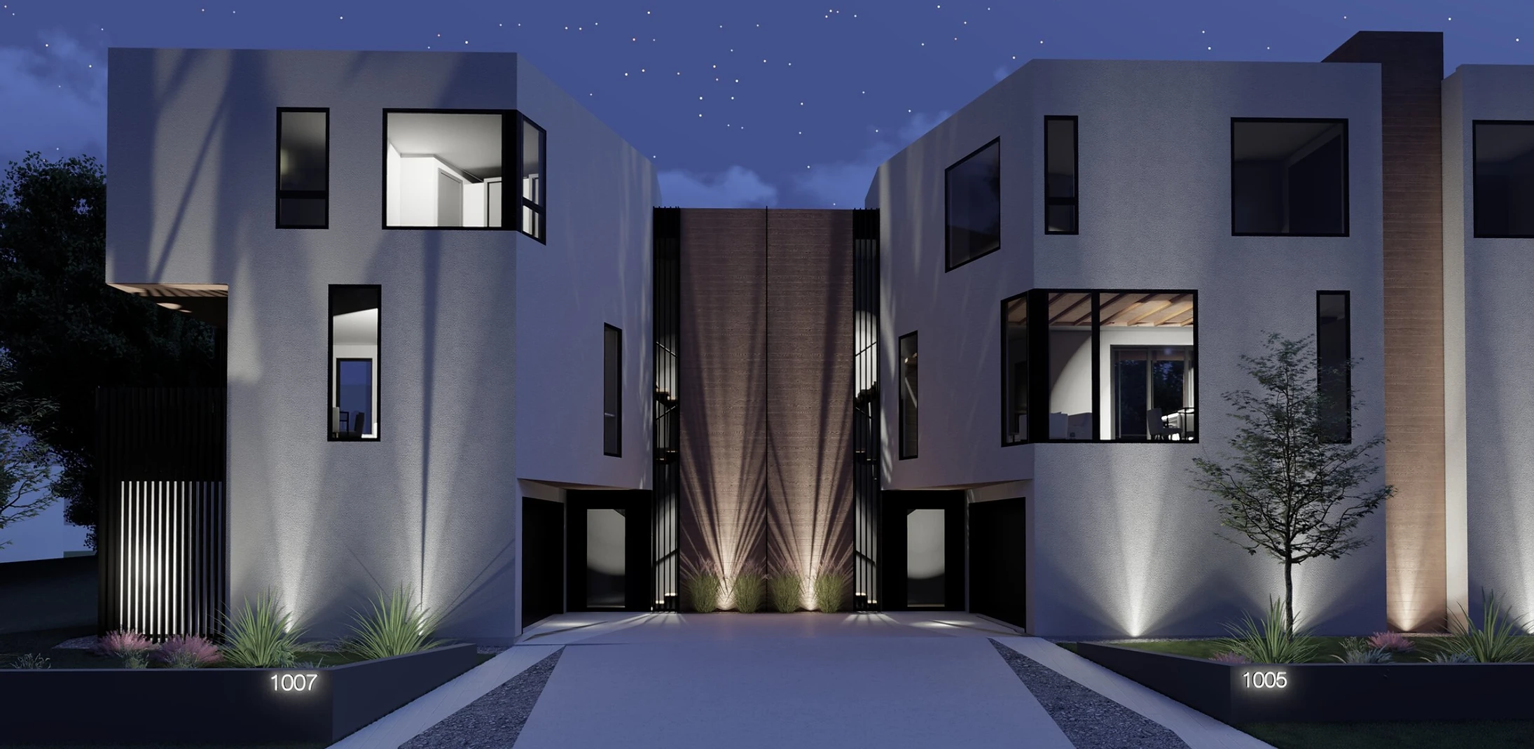 Front of modern home at night with spotlights